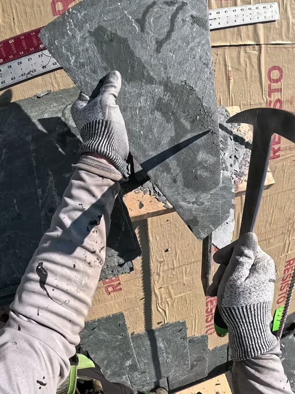 Cutting a slate with a slater's hammer